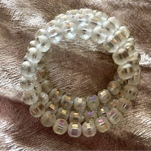 Vtg Crystal Bracelet Frosted w the middle shining IRIDESCENT Heavy Spring Wire